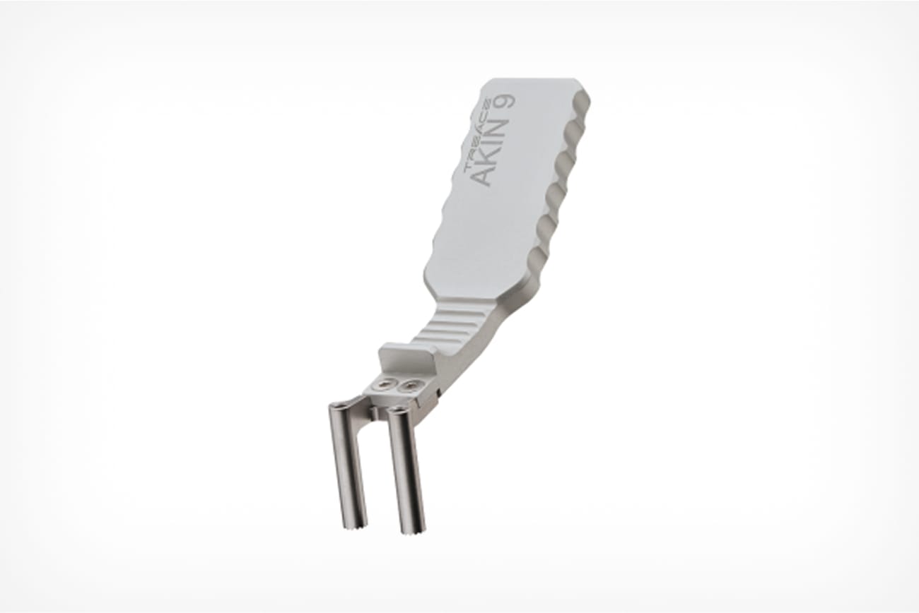 white and silver ATKINS-9 automotive hose remover tool with a textured handle and dual prong design against a white background
