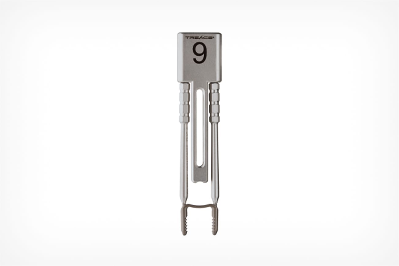 Silver tuning fork with the number 9 on top, featuring a specialized design for specific musical applications.