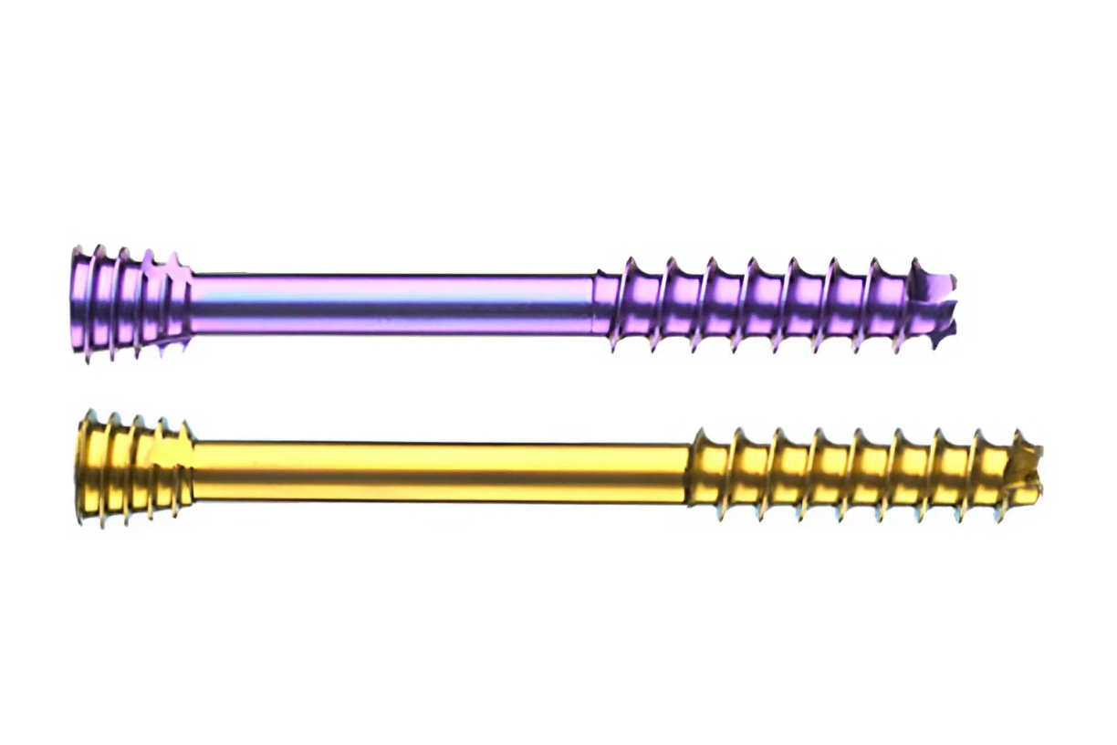 Two colorful dental abutment screws, one purple and one yellow, displayed horizontally on a white background.