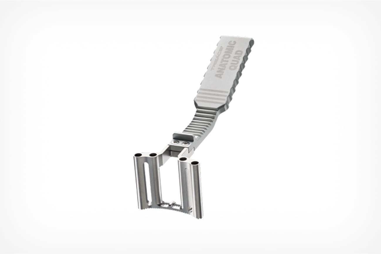 Compact gray metallic tool with a textured handle and hinged twin roller design for enhanced grip on various surfaces.