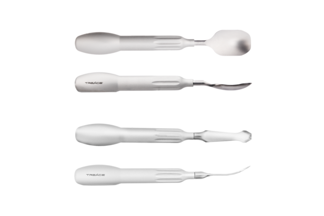 Set of four surgical chisels and elevators with white handles on a white background.